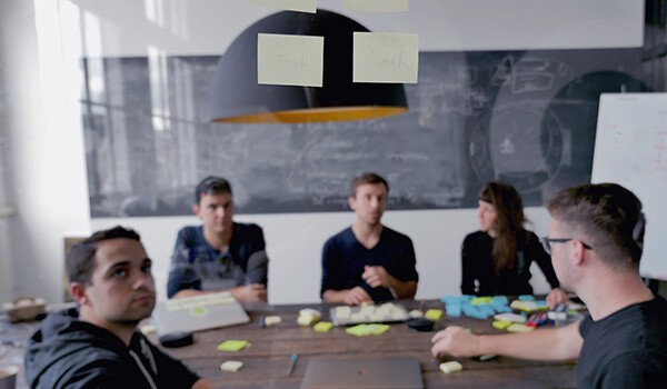 Yoav Farbey (centre) in action with the product team